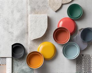 Assortment of paint cans, tiles, and sanitary ware.